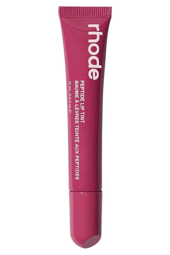 Original photograph of a closed berry-colored rhode lip tint tube with white lettering